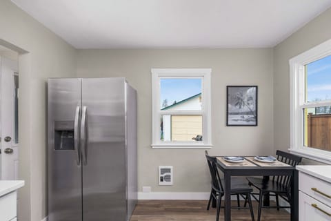 Plenty of space in the brand new refrigerator and we have a small dining table.