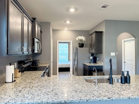 Fully stocked kitchen with stainless steel appliances