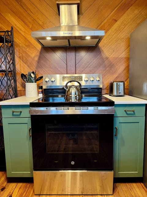 Note the custom wooden walls in the kitchen.