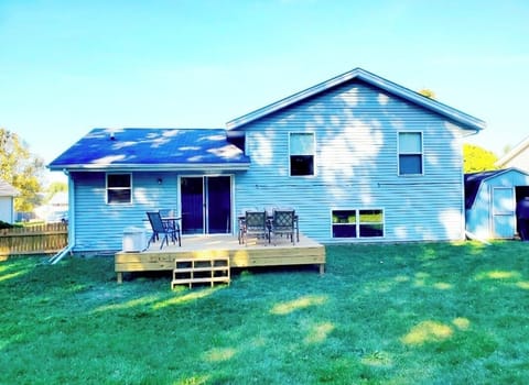 Back view of house and new deck from back yard. 