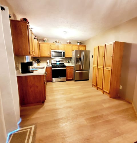 Fully equipped kitchen includes a french door fridge with ice/water in the door.