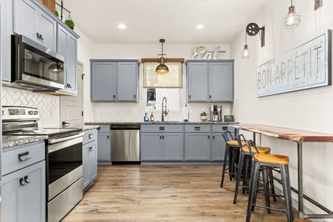 Cook, dine, and feel at home in this well-stocked kitchen.
