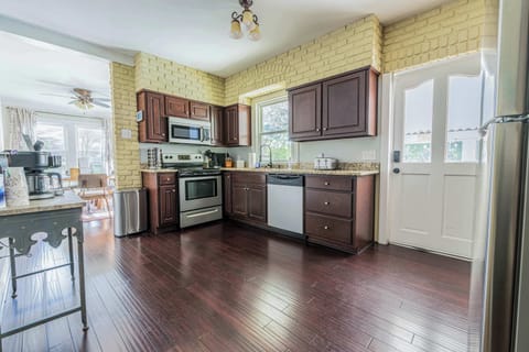 "This charming kitchen blends classic and contemporary styles, creating a warm and inviting space. Enjoy cooking in a space that's both functional and stylish."