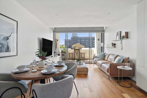 Elegant dining area with seating for up to four, seamlessly flowing into the cosy lounge for a relaxed and inviting atmosphere.