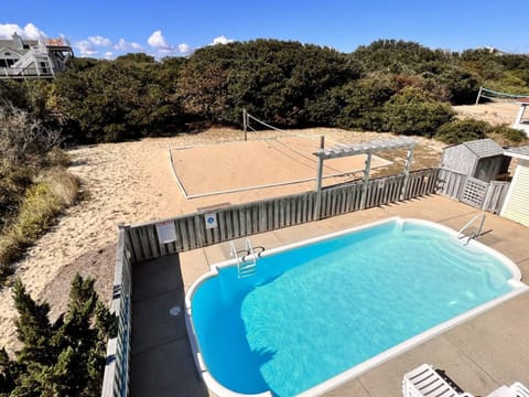A backyard oasis - pool, peaceful ambiance, and cozy seating.