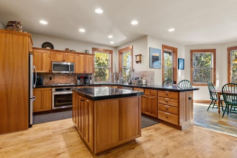 The warm, open kitchen offers ample space & every home comfort
