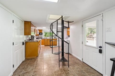 Enjoy a bonus kitchen and laundry room, providing added convenience in this scenic lakeside retreat