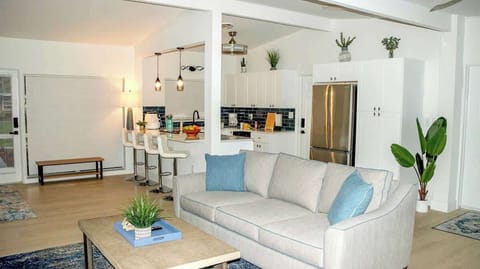 A welcoming living room featuring comfortable seating, ideal for watching movies or unwinding after a day of adventure.