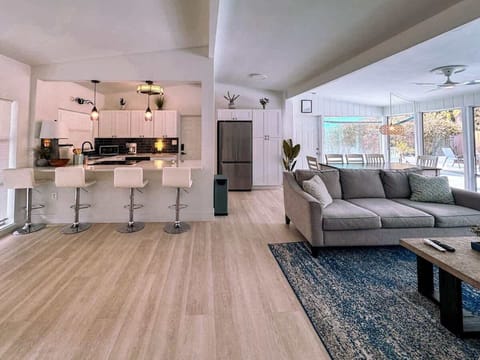 Spacious living room with comfortable sofa where you can watch TV