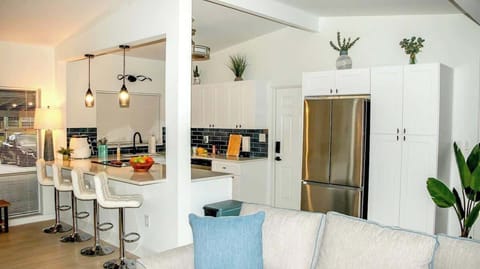 Spacious living room with comfortable seating, perfect for relaxation after a day of exploring Orlando.