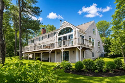 A beautiful lake-front Orleans vacation home on Pilgrim Lake, offering classic Cape Cod charm, spacious outdoor living, and a peaceful private setting surrounded by natural beauty.