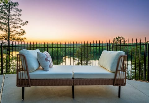 Unwind on the poolside bench with a perfect view of the lake, offering a quiet spot to relax and recharge.