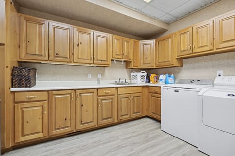 Laundry room perfect for longer stays and group convenience