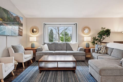 Comfy, relaxed seating in the upper living room for 8+. Smart TV, games provided