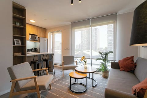 Enjoy the cozy elegance of this modern living room with stunning city views, perfect for relaxation and quality time.