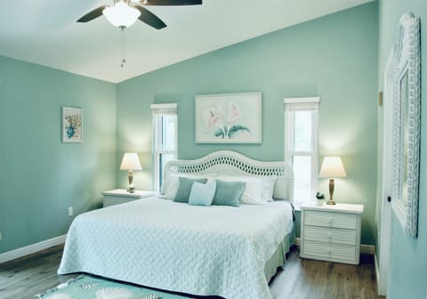 Master bedroom, King bed (blue blanket) 
Sliding door to the pool