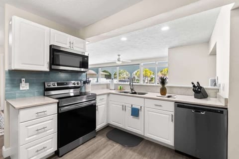 Kitchen with view to pool and living