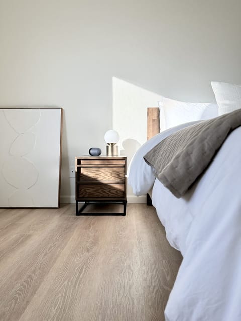 Fine furnishings, curated art, and a Bluetooth speaker for a relaxing retreat.