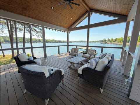 Covered porch with panoramic water view.