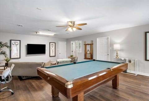 First floor living area with ample seating, flat-screen Roku TV and pool table. Pool balls and cue sticks provided.