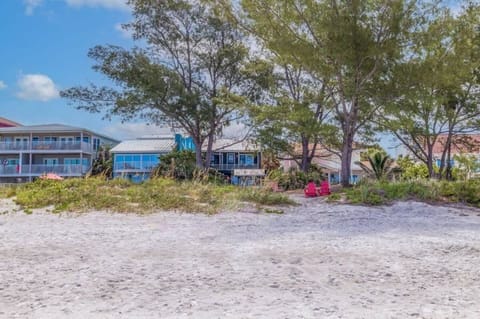 Stunning outdoor space where you can kick back with your feet on the sand, lounge on stylish outdoor furniture, or play a round of pool. Relax in the gazebo and take in the spectacular views of Indian Shores Beach.