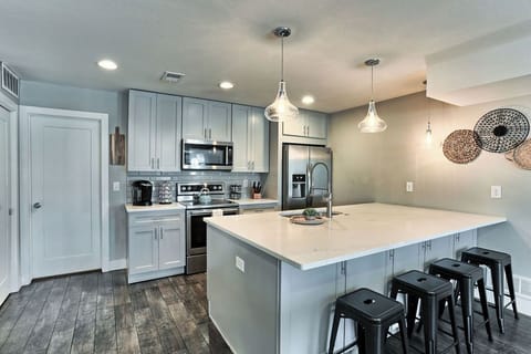 Modern appliances and design highlight the vibrant kitchen