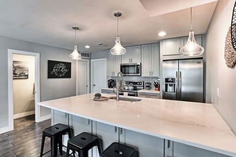 The large kitchen counter is a perfect breakfast nook spot with extra seating
