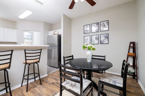 Dining room seats four at the table and two at the bar