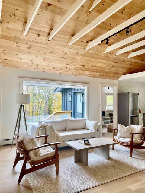 Large exposed beams with 2 XL windows to frame views of the forest 