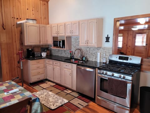 KITCHEN:  The home has a very large kitchen with all appliances including a dishwasher as well as a dining area that seats 4 adults.