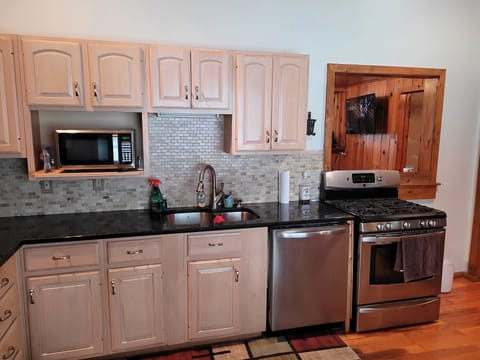 KITCHEN:  The home has a very large kitchen with all appliances including a dishwasher as well as a dining area that seats 4 adults.