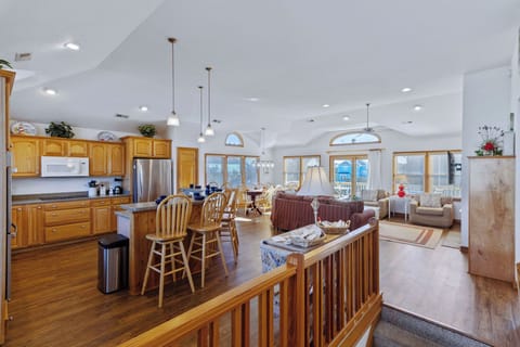 Living Space overlook - Large windows with natural light amplify the high ceilings in the home's open living spaces.