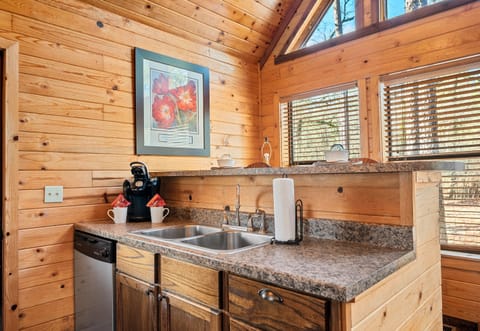 Start your mornings right with a fresh cup from this thoughtfully placed coffee station.