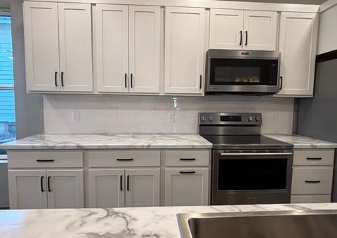 New house kitchen update April 2025. Stainless steel appliances and the tile backspash for the win!