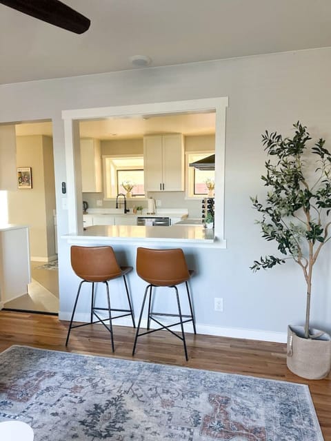 With stylish bar stools and a fluffy rug, it’s all about comfort and charm.