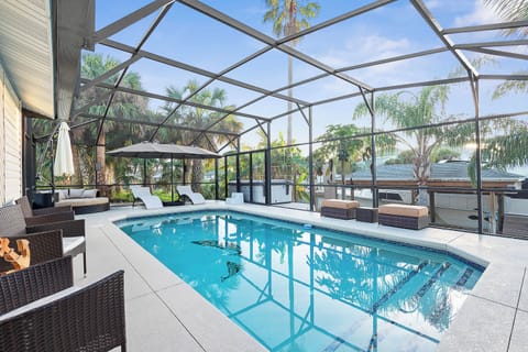 Pool area overlooking salt water canal 