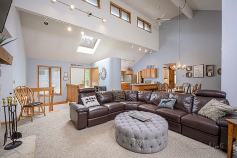 The great room features a beautiful open floor plan with vaulted ceilings.