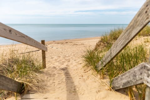 Walk a half mile down our tree lined road to a beautiful Lake Michigan beach! 