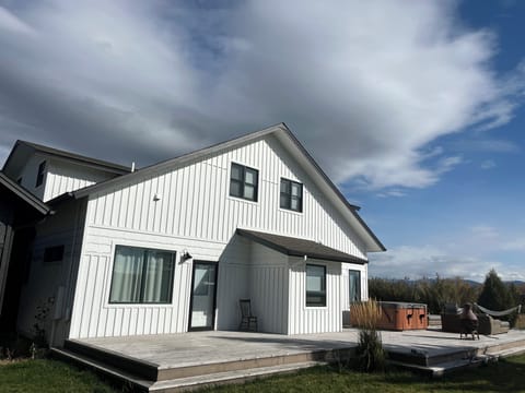 Enormous back deck that wraps around the side and back of the house.