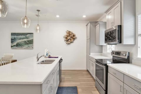 Modern kitchen with stainless steel appliances and a spacious dining area perfect for family meals.