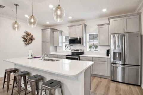 Modern kitchen with stainless steel appliances and a spacious dining area perfect for family meals.