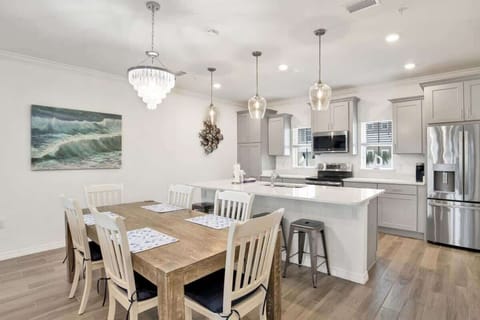 Modern kitchen with stainless steel appliances and a spacious dining area perfect for family meals.