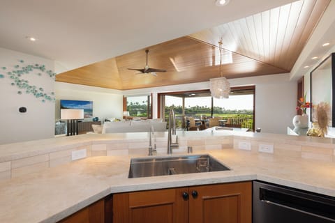 Your gourmet kitchen opens to stunning views, featuring premium countertops and modern appliances for memorable meal preparation.