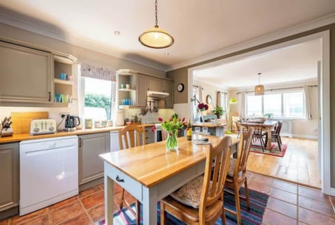 Open plan kitchen with electric oven, fridge, dishwasher, microwave etc..