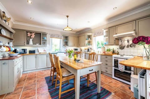 Spacious well equipped kitchen leading into Utility Room.