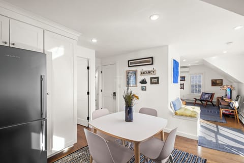 This modern dining area seats four, offering the perfect spot to share meals.