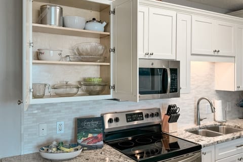 Modern newly renovated kitchen with 3 bar stools for fun times preparing your favorite beach meals!