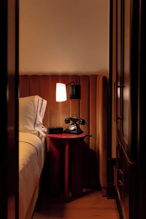 Unwind beside warm lighting and a plush, sound-sleep bed.
