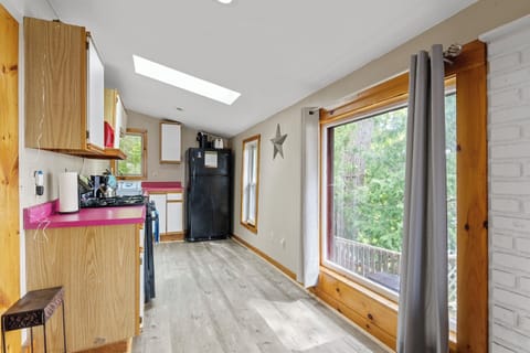 Dining Area - This fully equipped kitchen with bright countertops and ample counter space is perfect for preparing meals after a day by the lake. The natural light streaming in creates a welcoming and practical space for cooking and socializing.