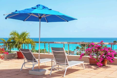 Watch approaching planes from the pool deck while catching rays.